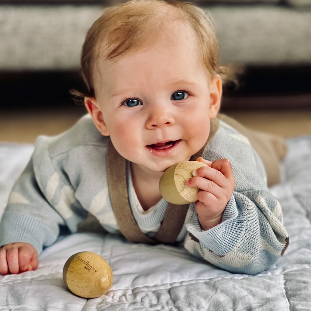 baby with egg shakers